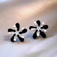 Angled view of the 14K Gold-Plated Christmas Velvet Snowflake Stud Earrings