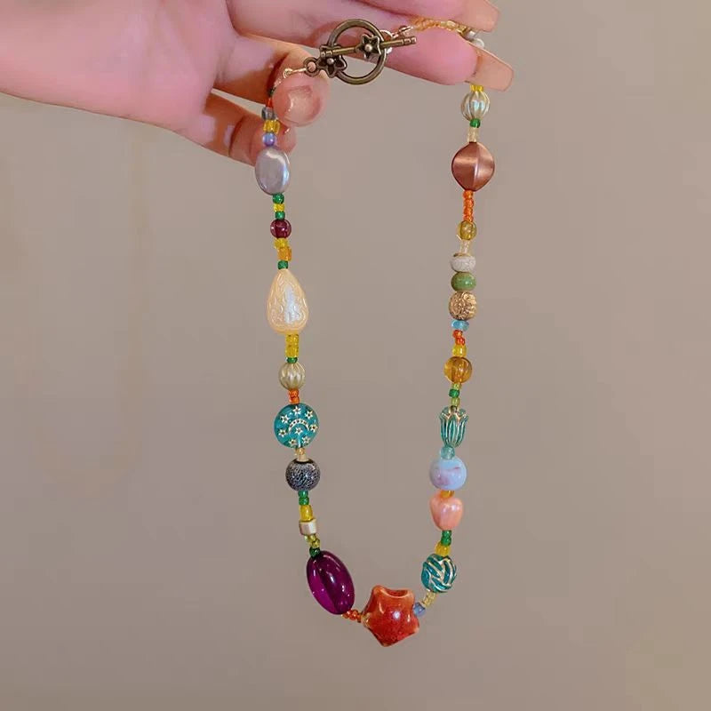 Detailed view of the 14K Gold-Plated Colorful Beaded Star Necklace chain and pendant