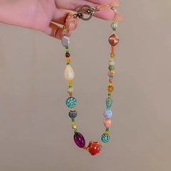 Detailed view of the 14K Gold-Plated Colorful Beaded Star Necklace chain and pendant