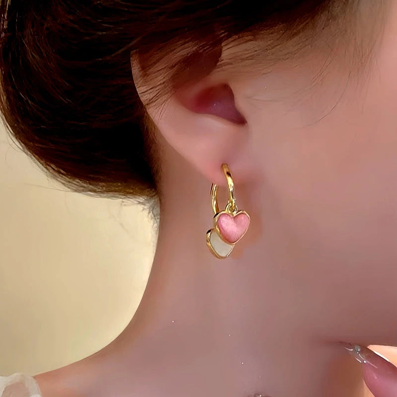 Close-up detail of the sparkling zircons and plating on the Contrasting Heart Earrings