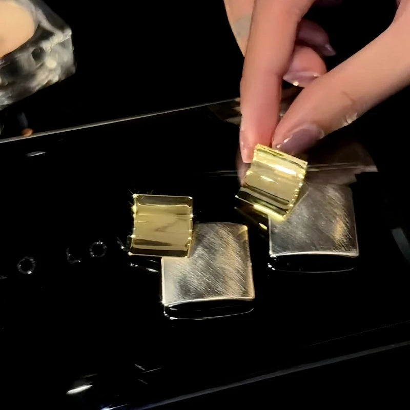 Close-up detail of the sparkling zircons and plating on the Contrasting Square Earrings