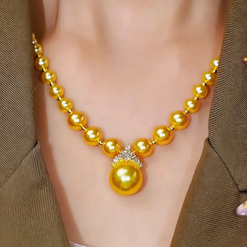 14K Gold-Plated Crown Gold Pearl Necklace worn to showcase its length and pendant detail