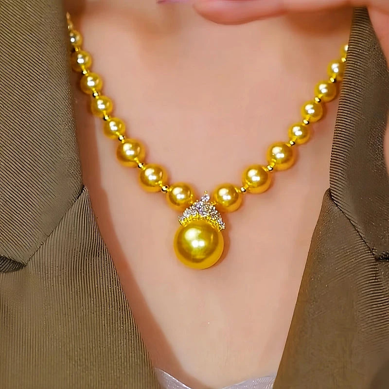 Close-up of the pendant and clasp on the Crown Pearl Necklace