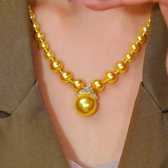 Close-up of the pendant and clasp on the Crown Pearl Necklace