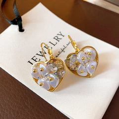Close-up detail of the sparkling zircons and plating on the Crystal Heart Earrings