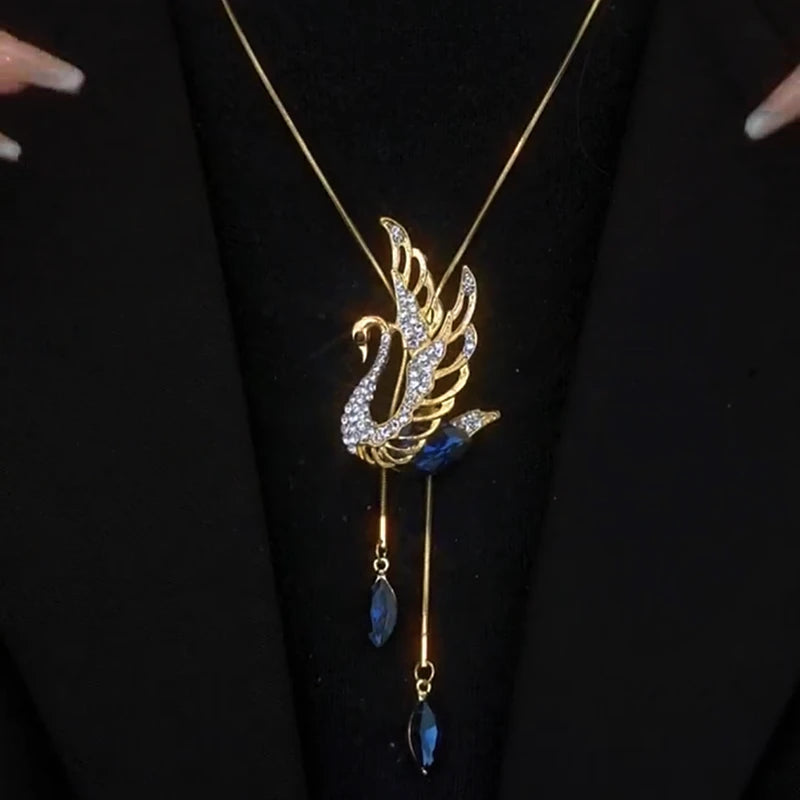 Close-up of the pendant and clasp on the Swan Sweater Necklace