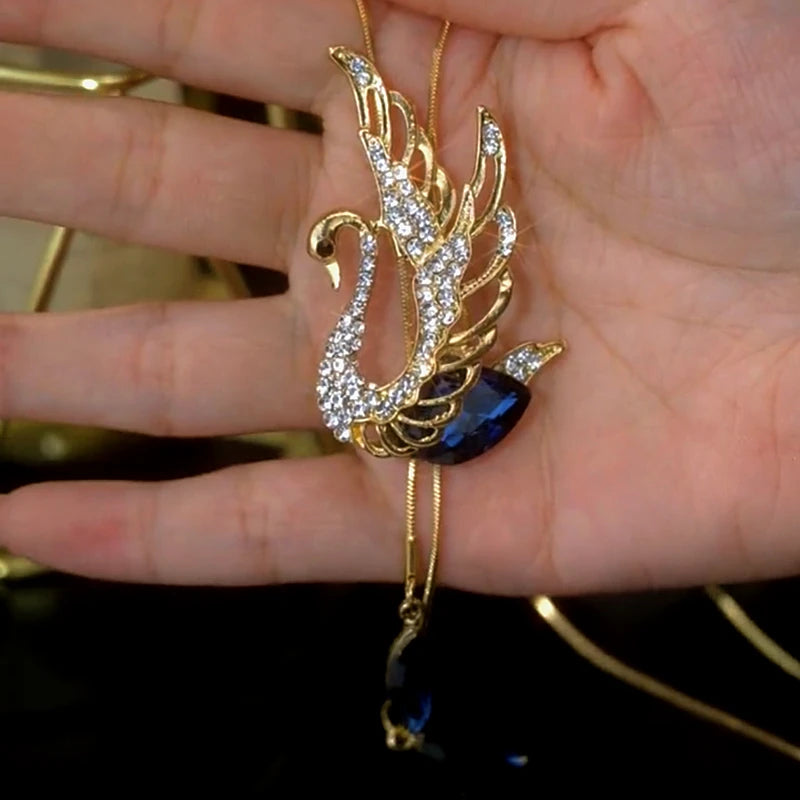 14K Gold-Plated Crystal Swan Sweater Necklace worn to showcase its length and pendant detail