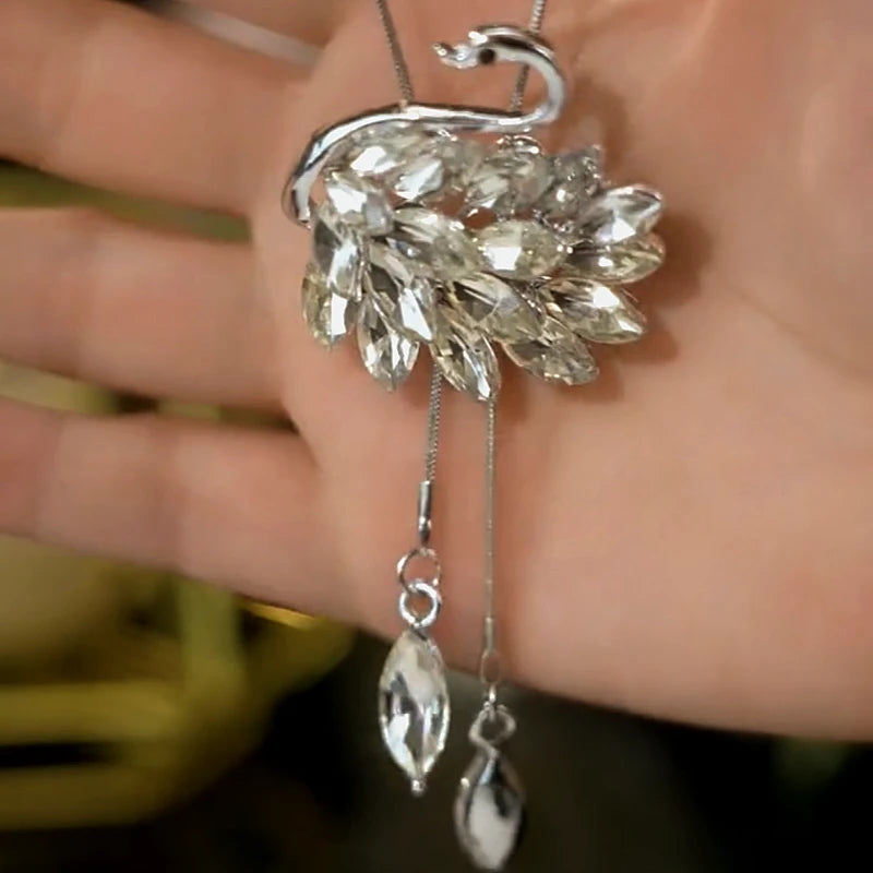 Detailed view of the 14K Gold-Plated Crystal Swan With Diamonds Necklace chain and pendant