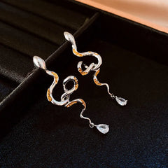 Angled view of the 14K Gold-Plated Curved Snake Zircon Water Drop Earrings