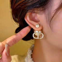 Model showcasing the dangle and style of the 14K Gold-Plated Daimond Bead Jacket Earrings