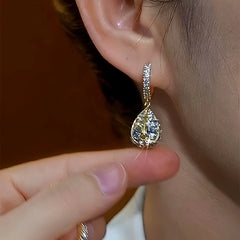Close-up detail of the sparkling zircons and plating on the Golden Water Drop Earrings