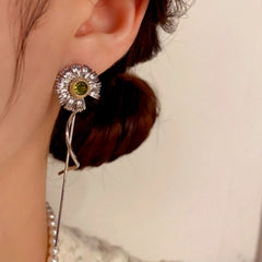 Close-up detail of the sparkling zircons and plating on the Daisy Tassel Earrings