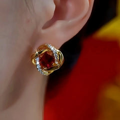 Close-up detail of the sparkling zircons and plating on the Red Crystal Studs