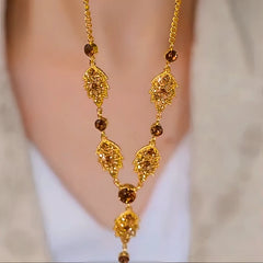 Close-up of the pendant and clasp on the Brown Leaf Necklace