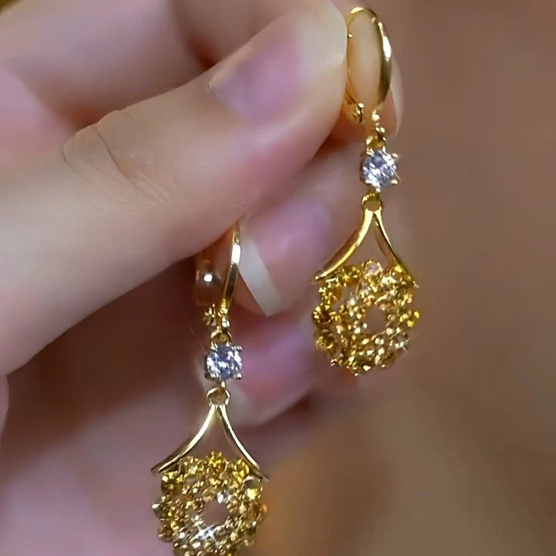 Close-up detail of the sparkling zircons and plating on the Water Drop Tassel Earrings