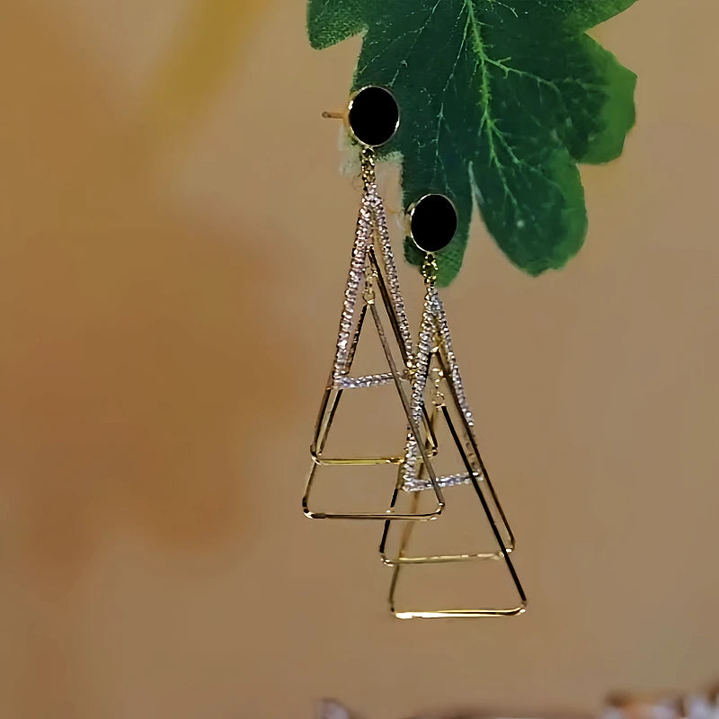 Angled view of the 14K Gold-Plated Diamond-Studded Three-Dimensional Multi-Layer Triangle Earrings