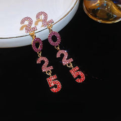 Angled view of the 14K Gold-Plated Diamond 2025 Digital Earrings