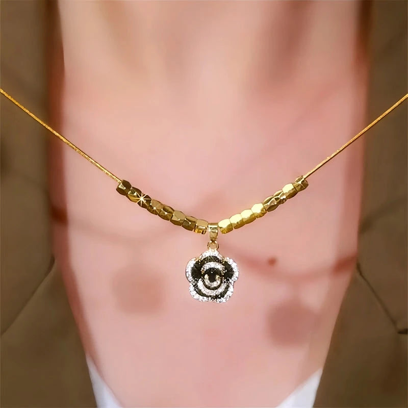 14K Gold-Plated Diamond Black Camellia Necklace worn to showcase its length and pendant detail