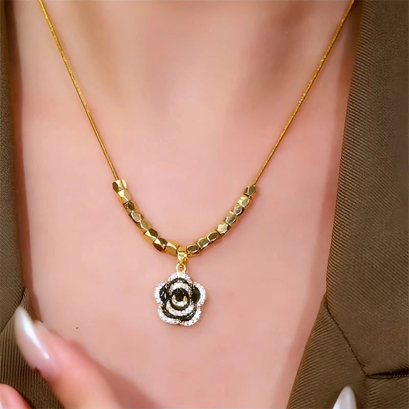 Close-up of the pendant and clasp on the Black Camellia Necklace