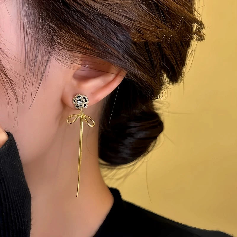 Close-up detail of the sparkling zircons and plating on the Camellia Tassel Earrings