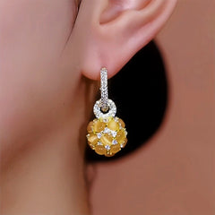 Close-up detail of the sparkling zircons and plating on the Cat's Eye Ball Earrings