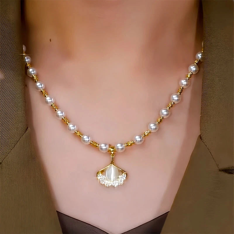 Close-up of the pendant and clasp on the Ginkgo Leaf Necklace