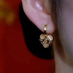 Close-up detail of the sparkling zircons and plating on the Cat's Eye Heart Earrings