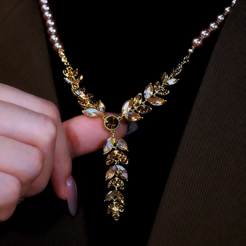 14K Gold-Plated Diamond Cat's Eye Wheat Pearl Sweater Necklace worn to showcase its length and pendant detail