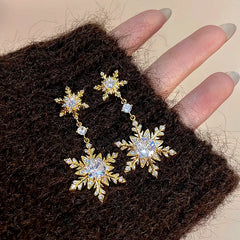 Angled view of the 14K Gold-Plated Diamond Christmas Double Snowflake Earrings