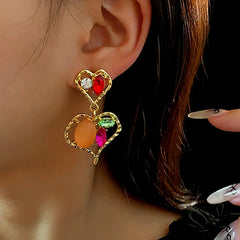 Close-up detail of the sparkling zircons and plating on the Double Heart Earrings