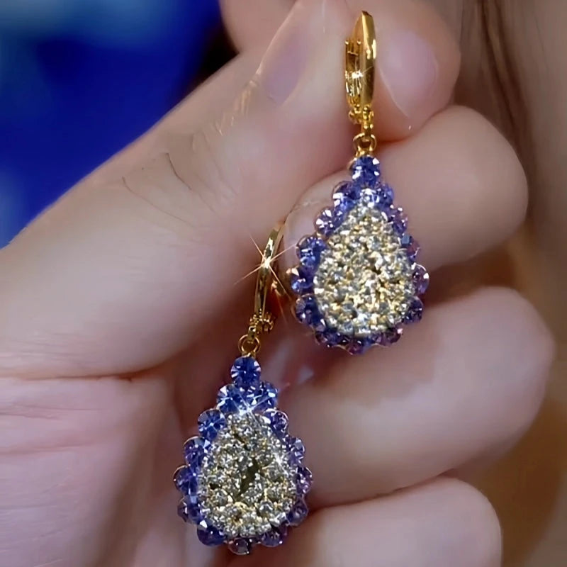 Close-up detail of the sparkling zircons and plating on the Purple Drop Earrings