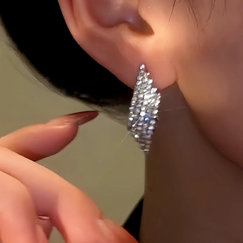 Close-up detail of the sparkling zircons and plating on the Silver Diamond Earrings