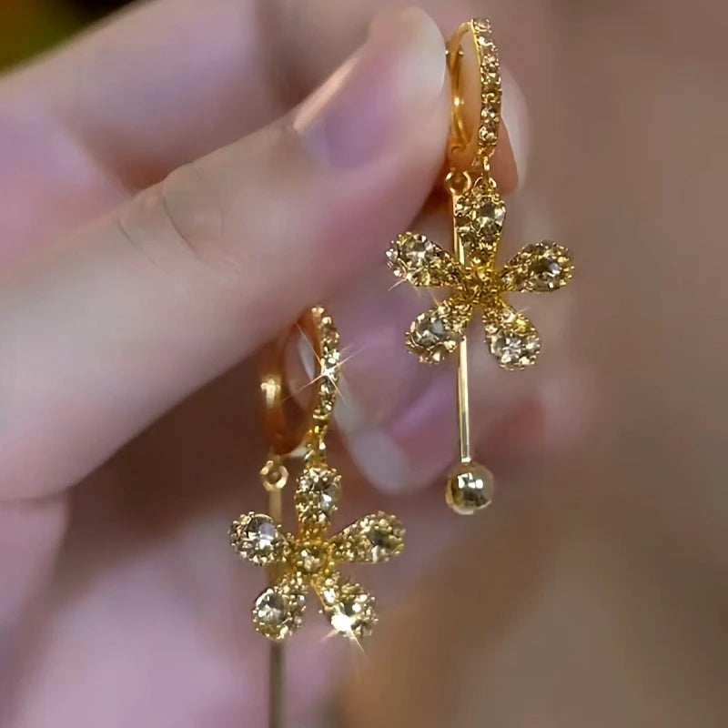 Close-up detail of the sparkling zircons and plating on the Brown Flower Earrings