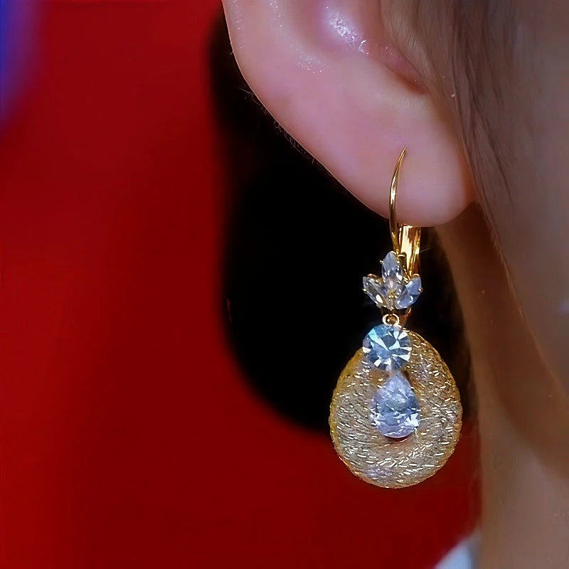Close-up detail of the sparkling zircons and plating on the Flower Mesh Earrings