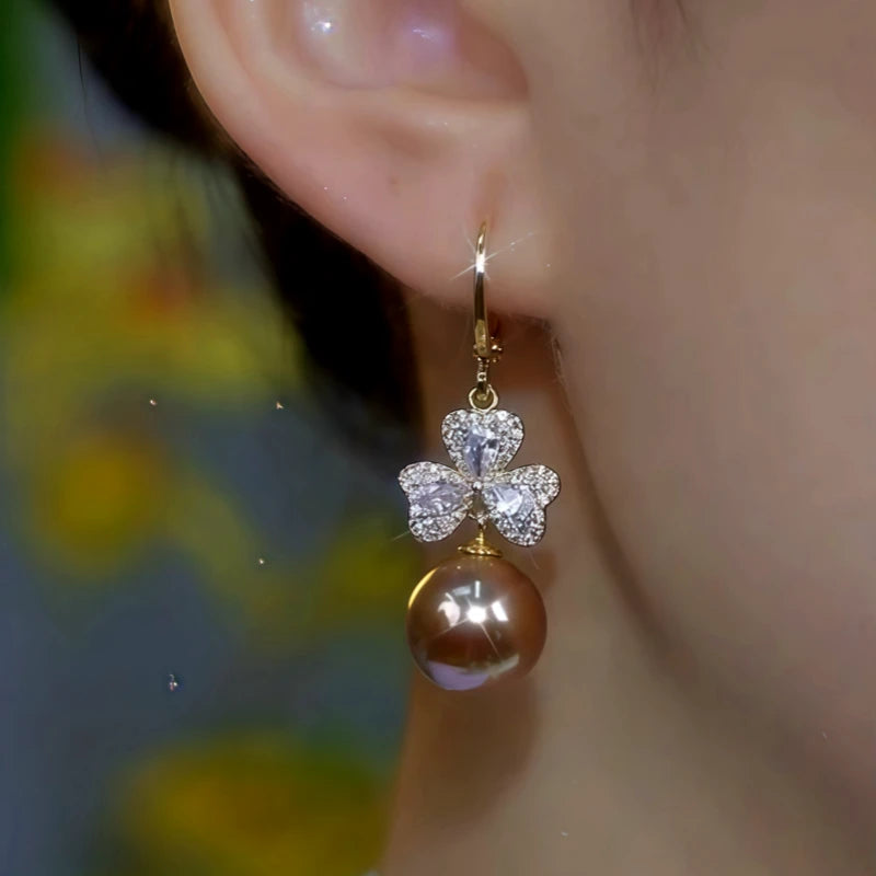 Close-up detail of the sparkling zircons and plating on the Brown Flower Pearl Earrings