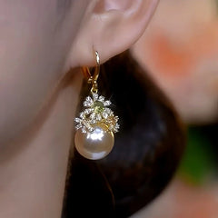Close-up detail of the sparkling zircons and plating on the Flower Pearl Earrings