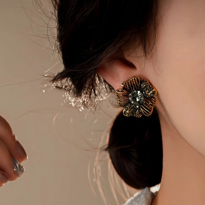 Close-up detail of the sparkling zircons and plating on the Black Flower Studs