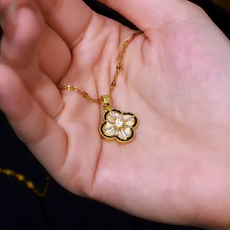 Close-up of the pendant and clasp on the Four-Leaf Flower Necklace