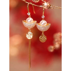 Angled view of the 14K Gold-Plated Diamond Gold Ingot Earrings