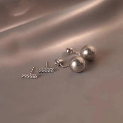 Angled view of the 14K Gold-Plated Diamond Gray Pearl Earrings