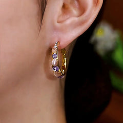 Close-up detail of the sparkling zircons and plating on the Purple Dangle Earrings