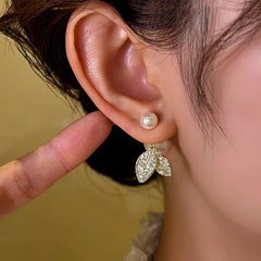 Close-up detail of the sparkling zircons and plating on the Leaf Pearl Earrings