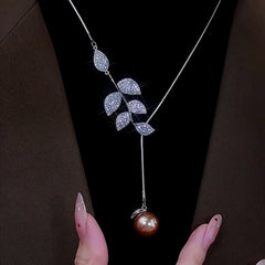 14K Gold-Plated Diamond Leaf Pearl Necklace worn to showcase its length and pendant detail