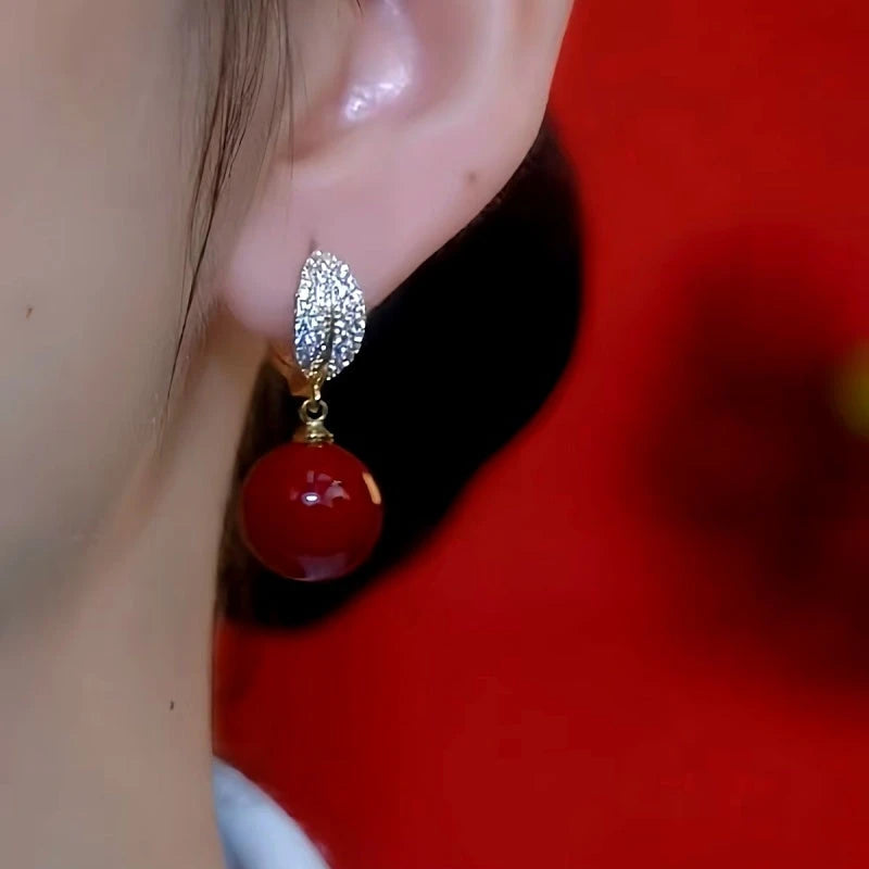 Close-up detail of the sparkling zircons and plating on the Red Bead Earrings