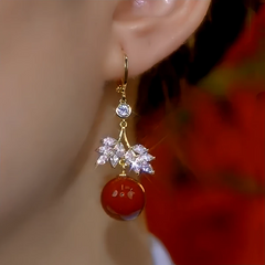 Close-up detail of the sparkling zircons and plating on the Threader Earrings