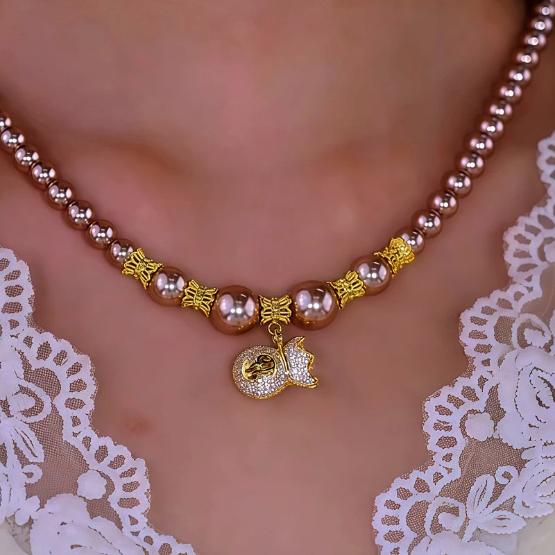 14K Gold-Plated Diamond Lucky Bag Pearl Necklaces worn to showcase its length and pendant detail