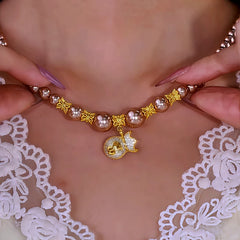 Close-up of the pendant and clasp on the Lucky Bag Necklace