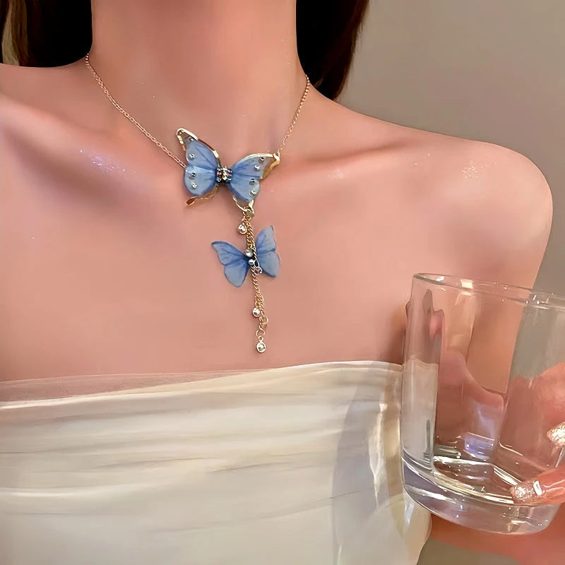 14K Gold-Plated Diamond Pearl Butterfly Tassel Necklace worn to showcase its length and pendant detail