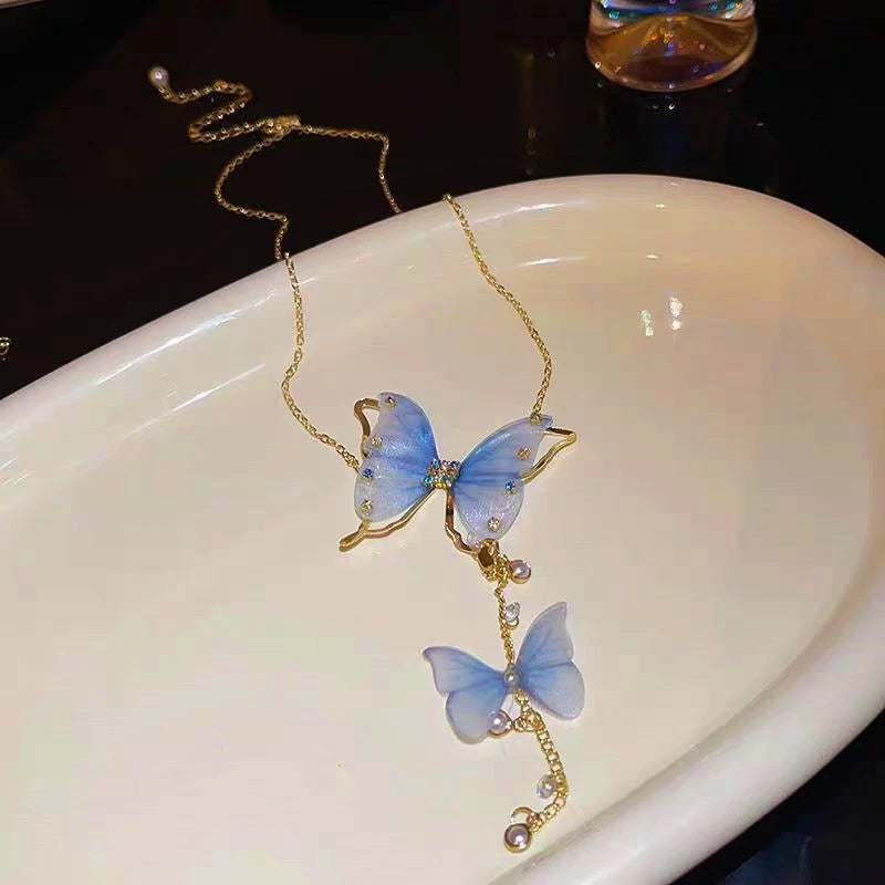 Detailed view of the 14K Gold-Plated Diamond Pearl Butterfly Tassel Necklace chain and pendant