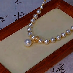Close-up of the pendant and clasp on the Brown Pearl Necklace